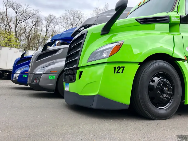 Green BihFreight truck 127 next to the fleet