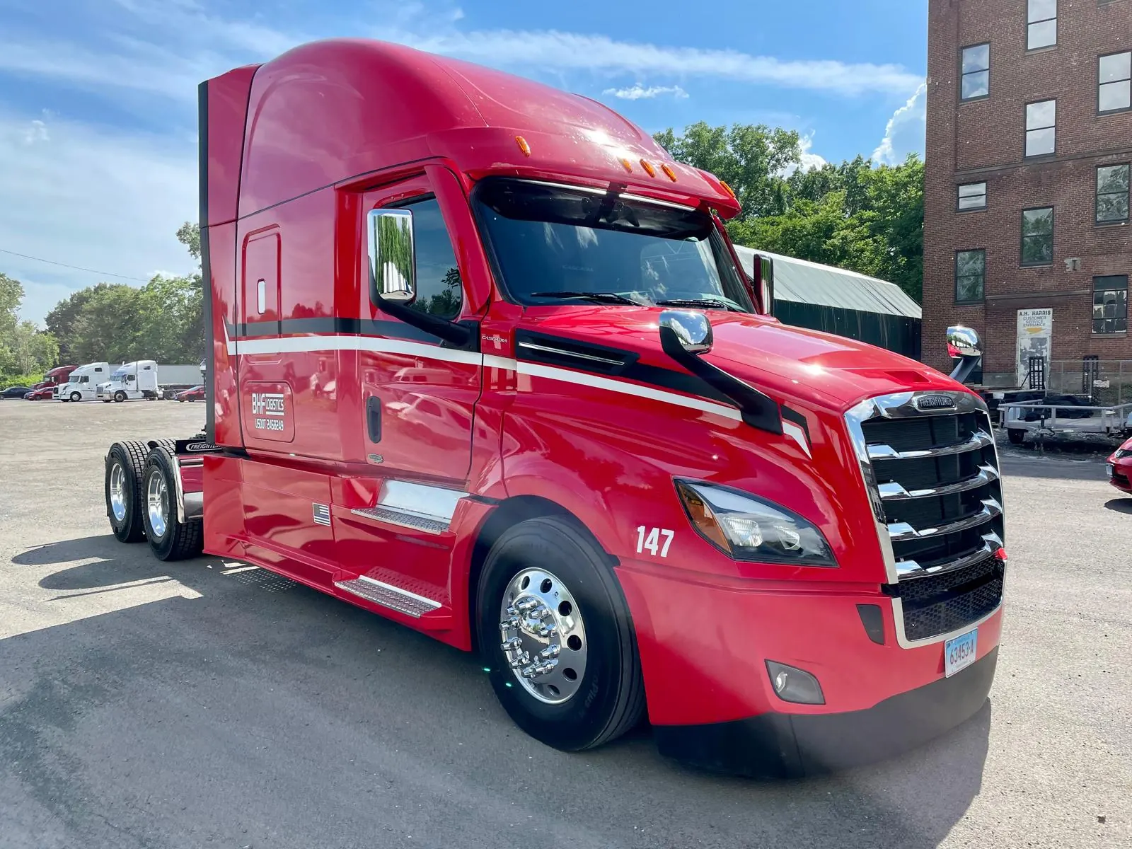 Red Freightliner truck, unit 147